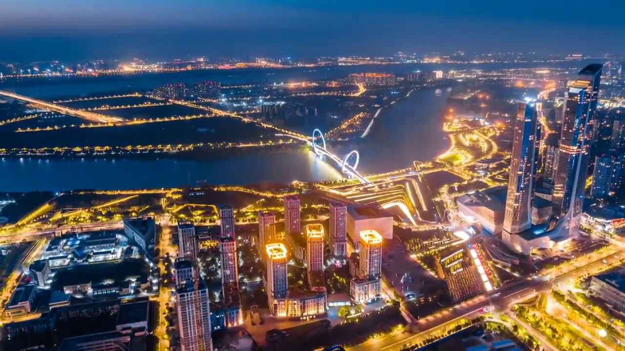 中国江苏南京青奥中心和南京眼大桥城市天际线航拍夜景环延时摄影视频素材