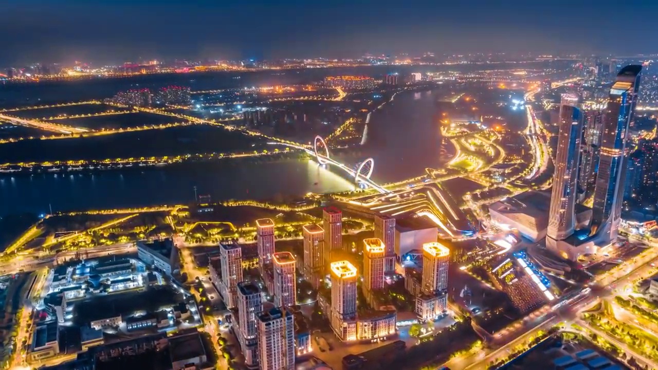 中国江苏南京青奥中心和南京眼大桥城市天际线航拍夜景环延时摄影视频素材