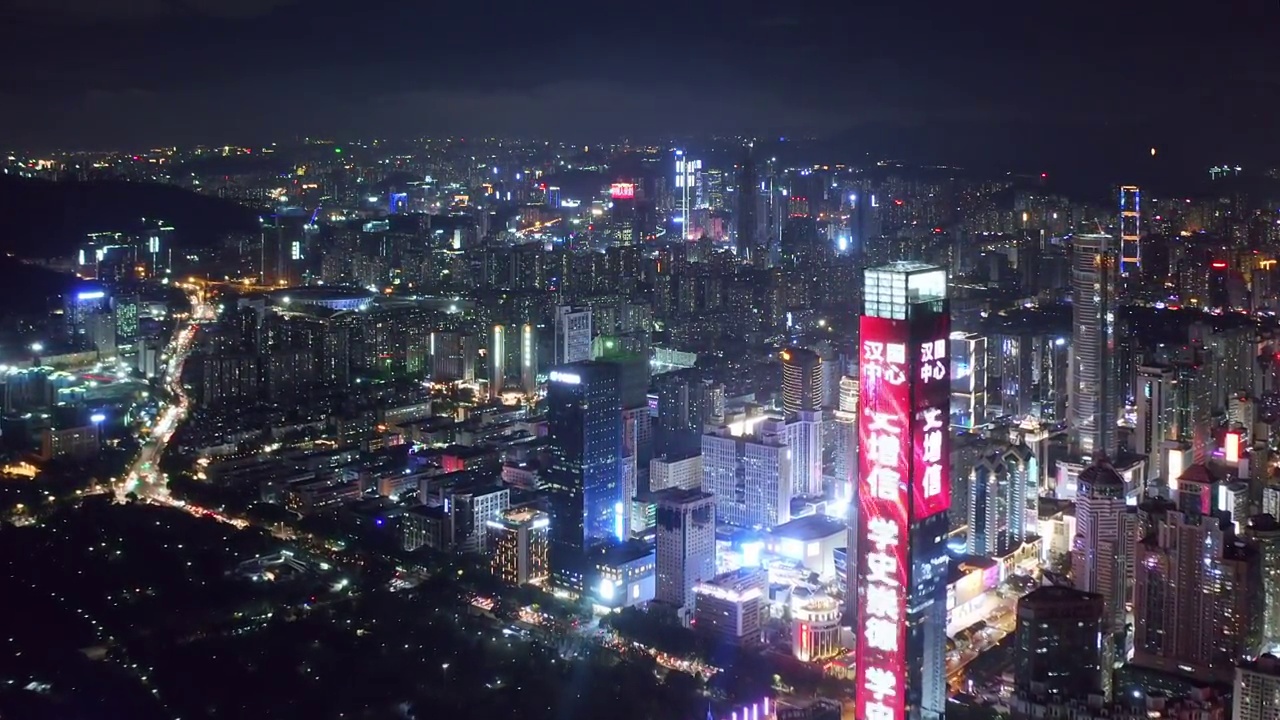 航拍夜晚深圳市中心现代抽象地标建筑和都市风光视频素材