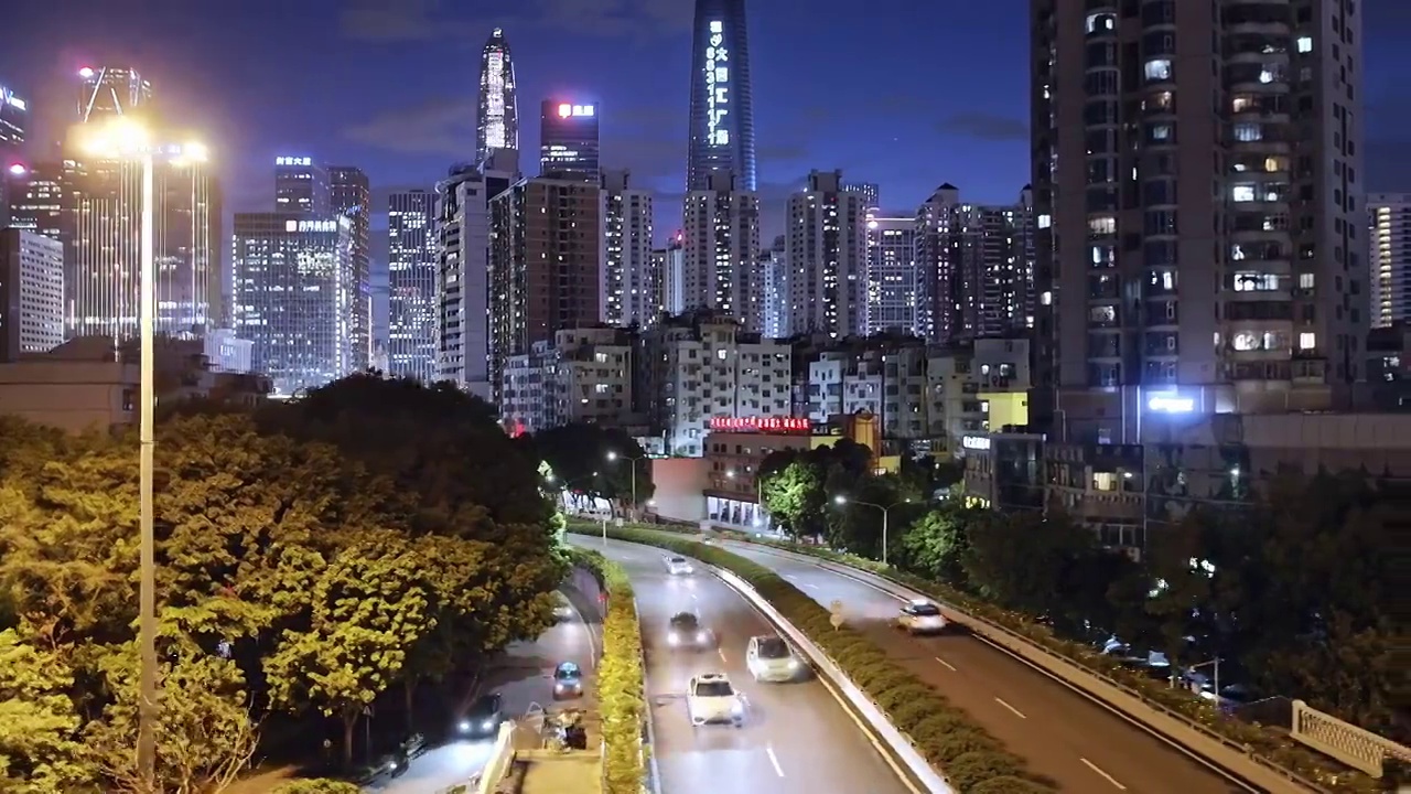 航拍夜晚深圳市中心现代抽象地标建筑和都市风光视频素材