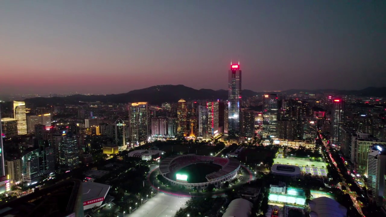 广东广州中信广场和前面的体育中心体育馆夜景视频素材