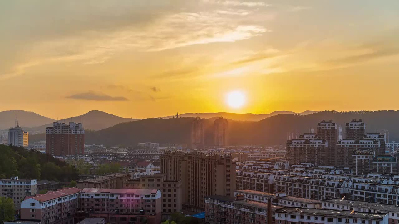 城市夕阳西下太阳落山延时视频素材