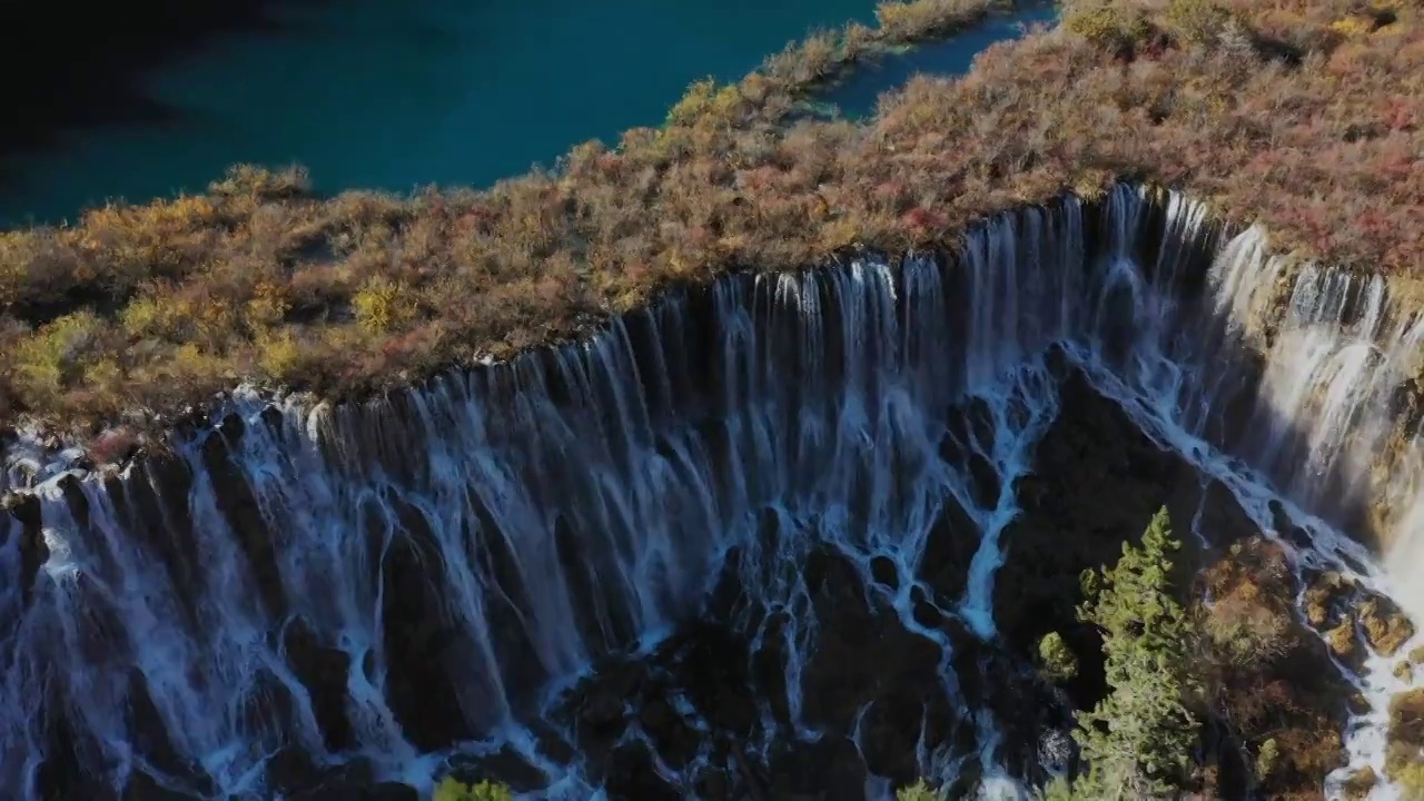 航拍九寨沟诺日朗瀑布和珍珠滩瀑布视频素材