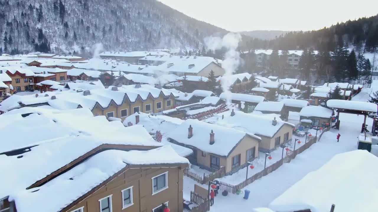 航拍中国雪乡炊烟袅袅视频素材