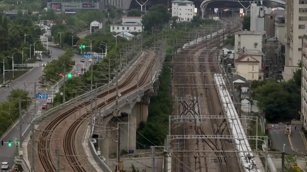 航拍城市中穿行的高铁动车视频素材