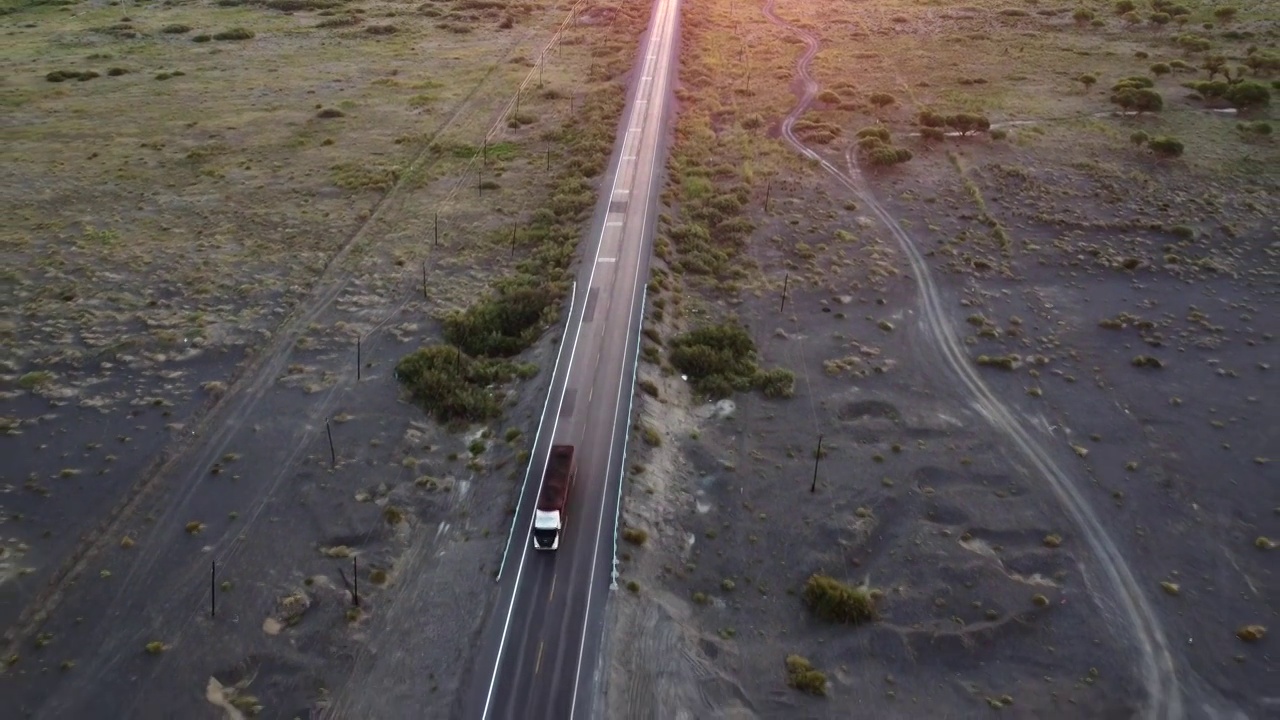 航拍行驶在笔直公路上的货车视频素材