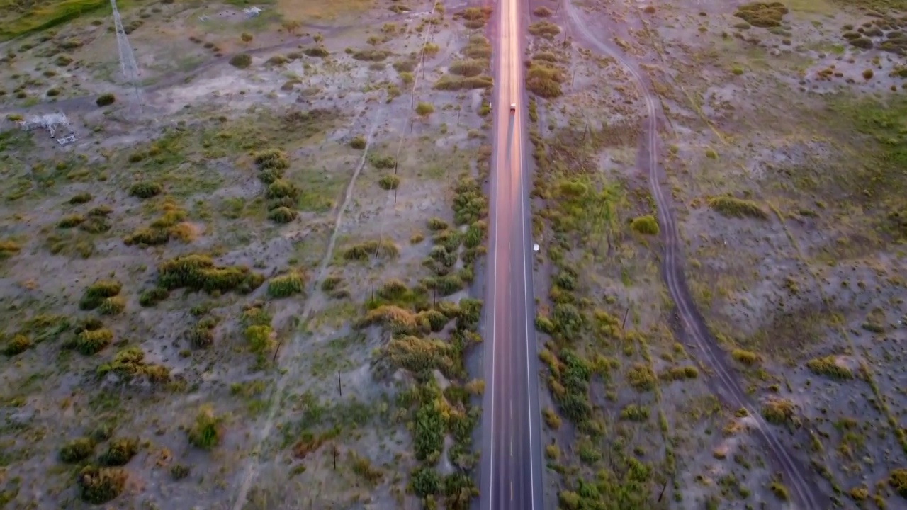 航拍行驶在笔直公路上的货车视频素材