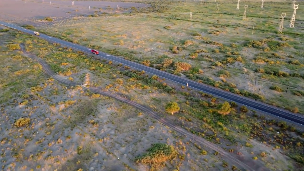 航拍行驶在笔直公路上的货车视频素材