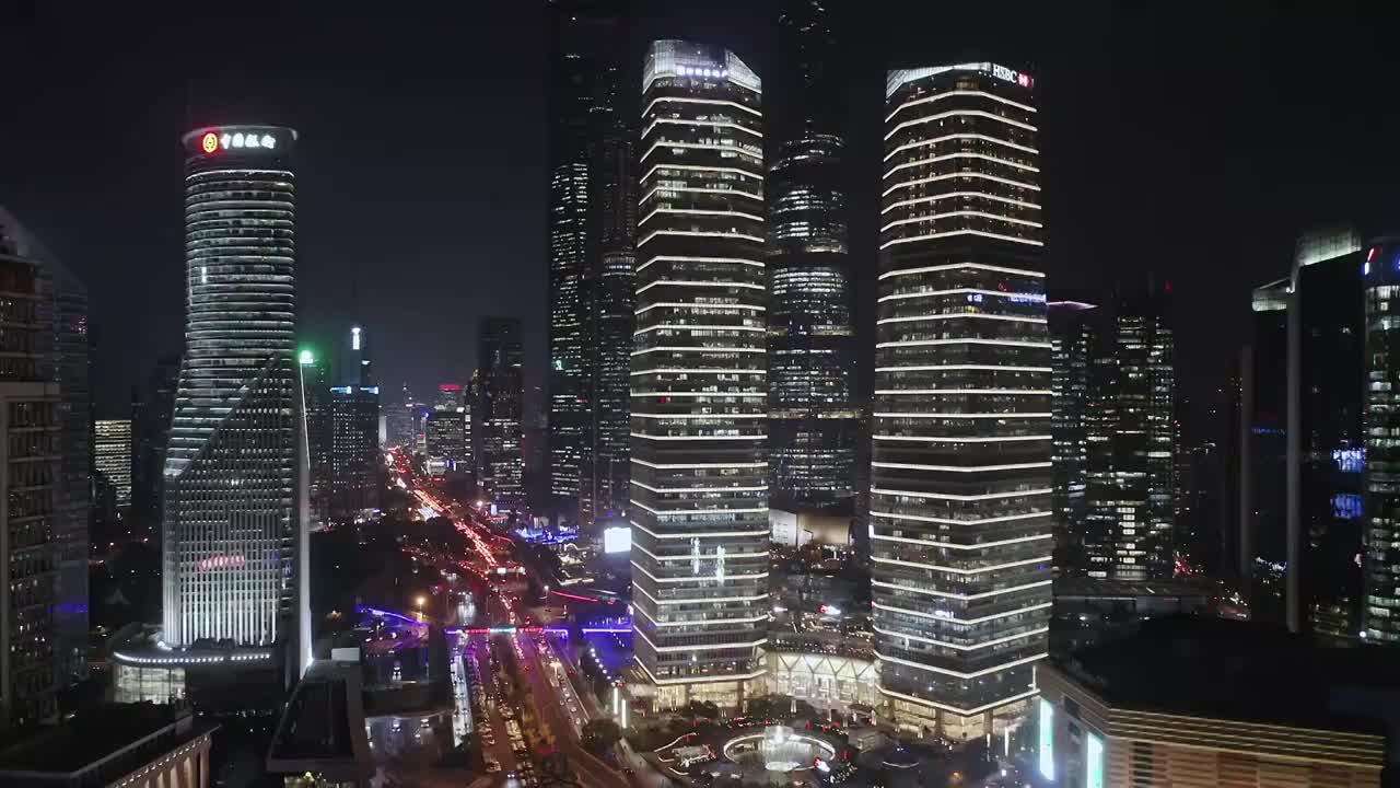 航拍商务办公楼建筑外立面灯光夜景视频素材