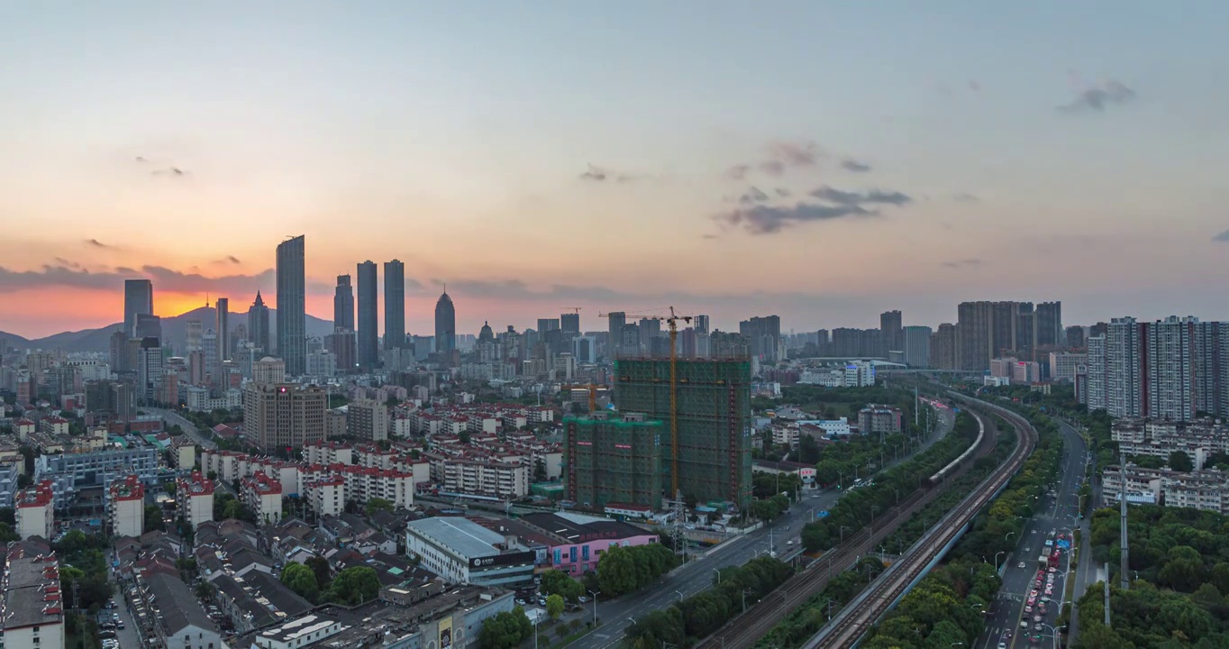 沪宁高铁无锡段城市建筑日落晚霞风光和高铁运输画面视频素材