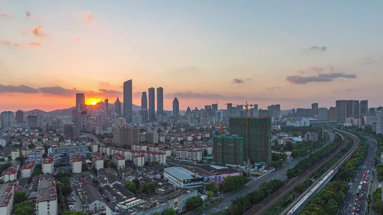 沪宁高铁无锡段城市建筑日落晚霞风光和高铁运输画面视频素材