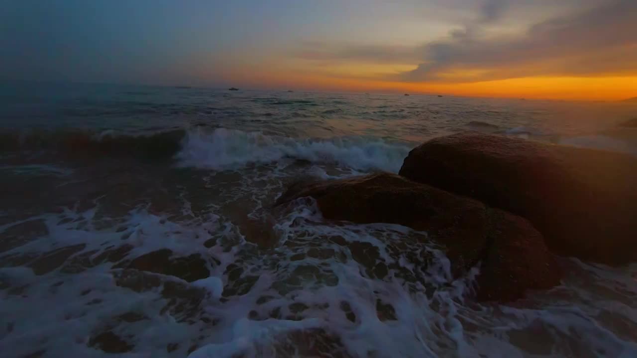 三亚海角天涯海边沙滩日落光晕视频素材