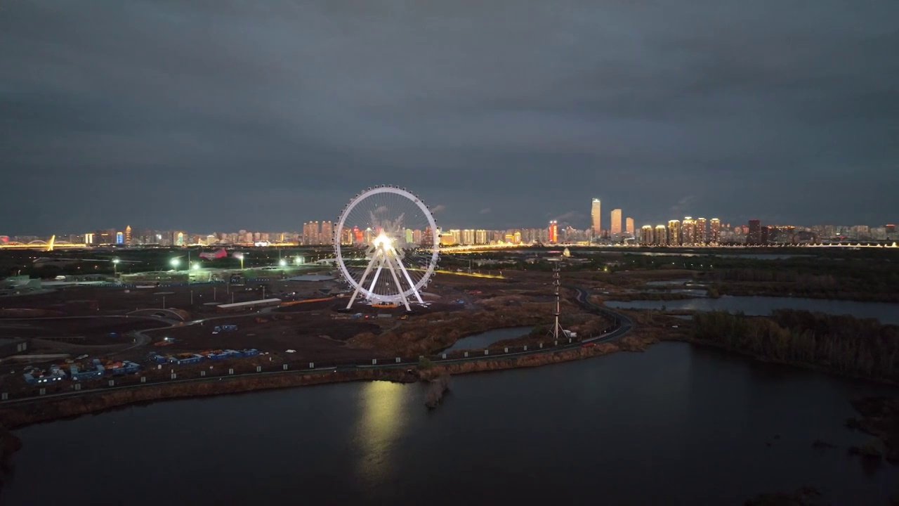 4K哈尔滨松花江游乐园冰雪摩天轮夕阳日落火烧云夜景航拍（合集）视频素材