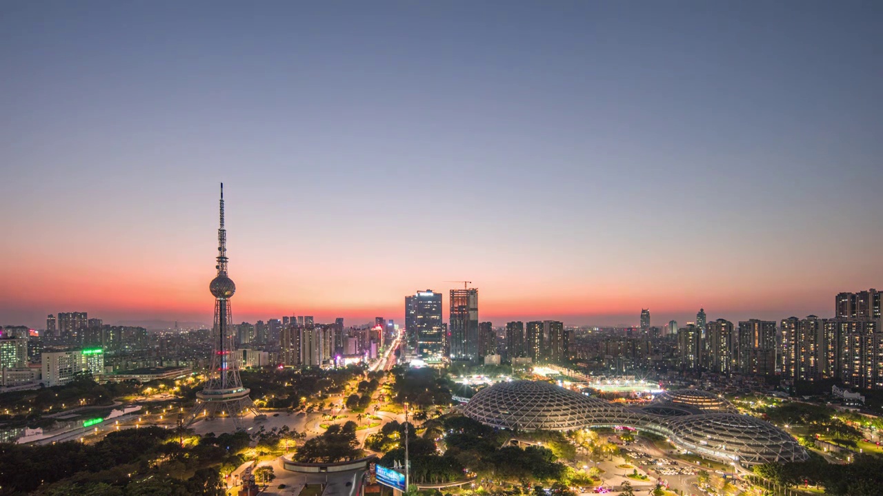 佛山电视塔和岭南明珠体育馆城市天际线日转夜延时摄影视频素材