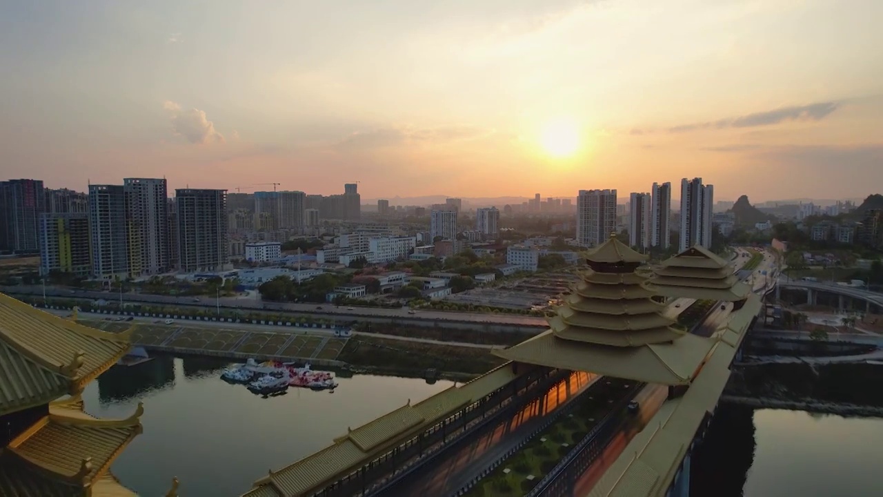 广西柳州凤凰岭大桥日落夕阳风雨桥城市建筑柳江风光航拍视频素材