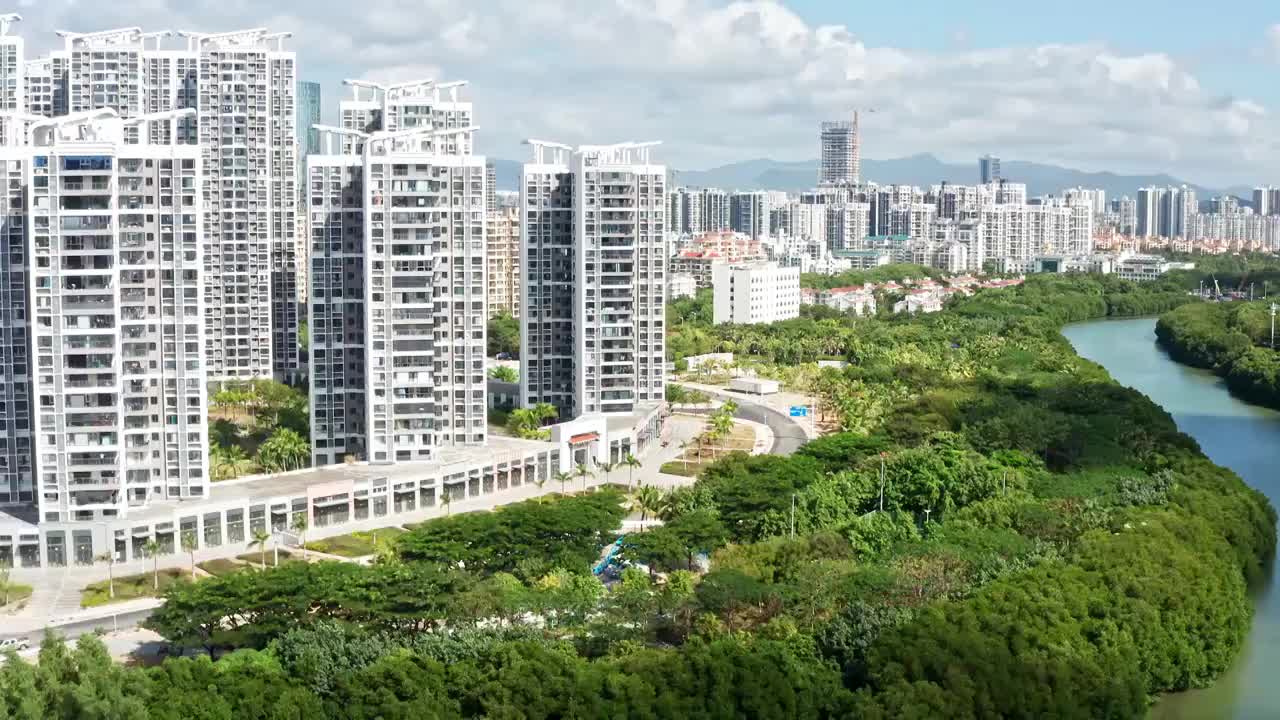 海南省三亚市市区临春河两岸城市风光航拍视频素材