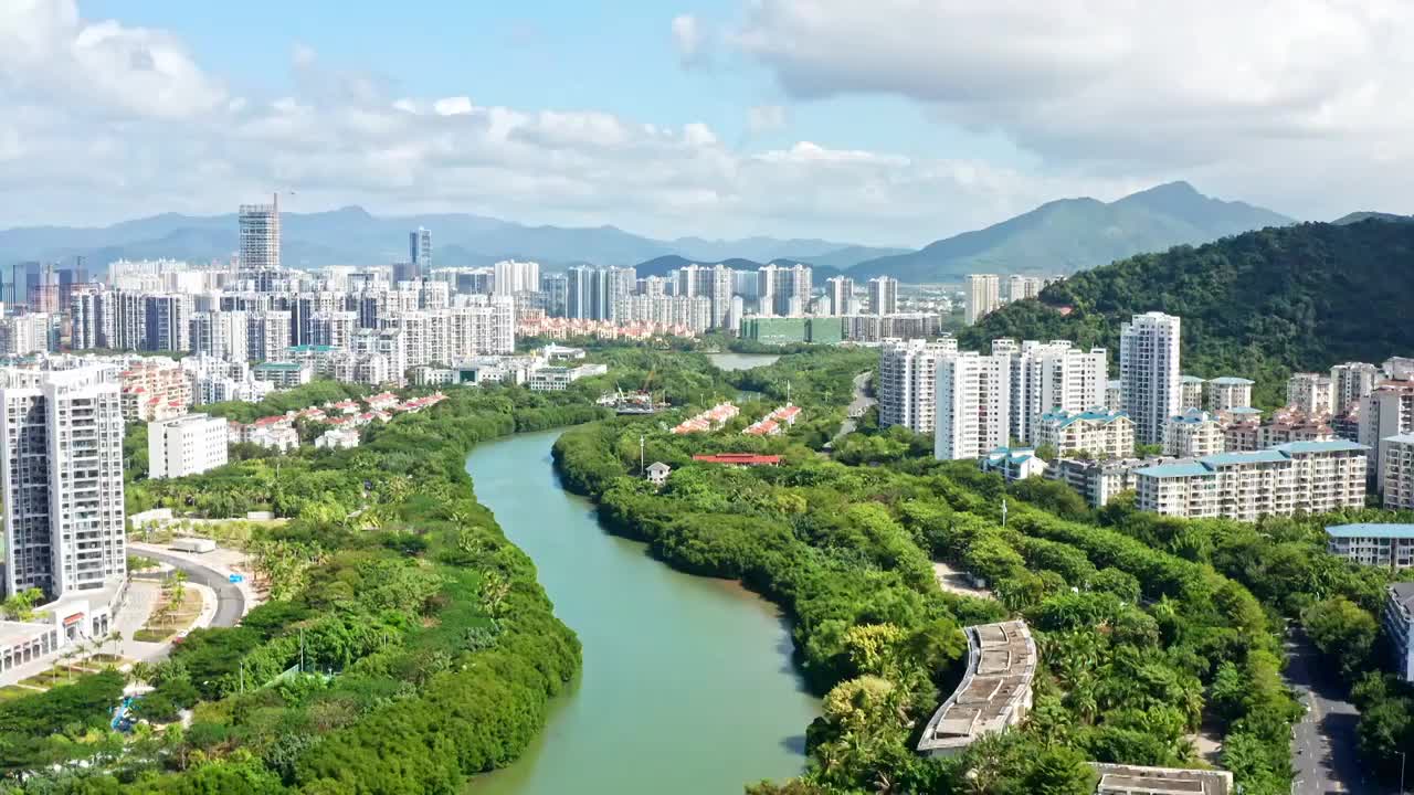 海南省三亚市市区临春河两岸城市风光航拍视频素材