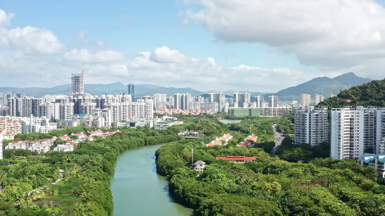 海南省三亚市市区临春河两岸城市风光航拍视频素材