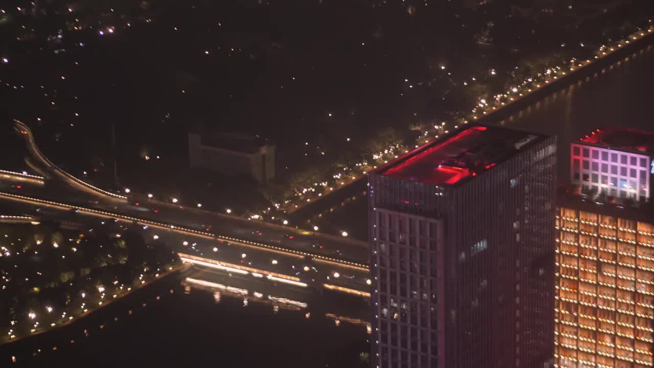 高空鸟瞰广州大桥二沙岛珠江新城广州大道LED灯饰璀璨道路车水马龙办公楼内透灯光漂亮城市烟火美好祥和视频素材