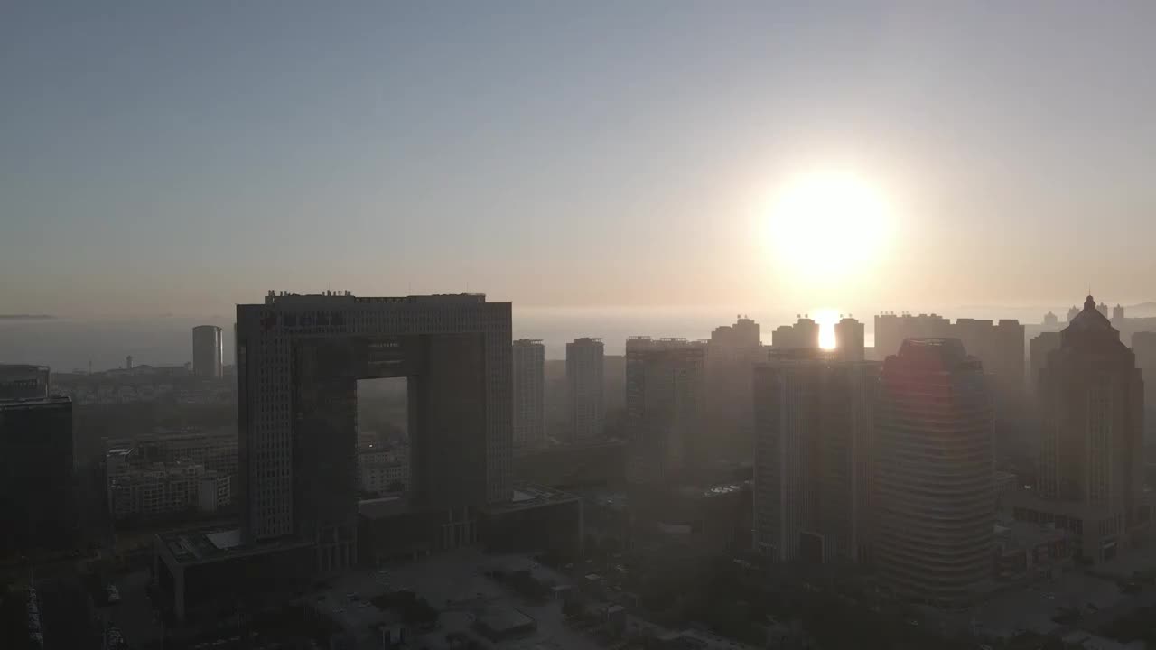 山东省烟台市莱山区高新区城市建筑群日出航拍视频素材