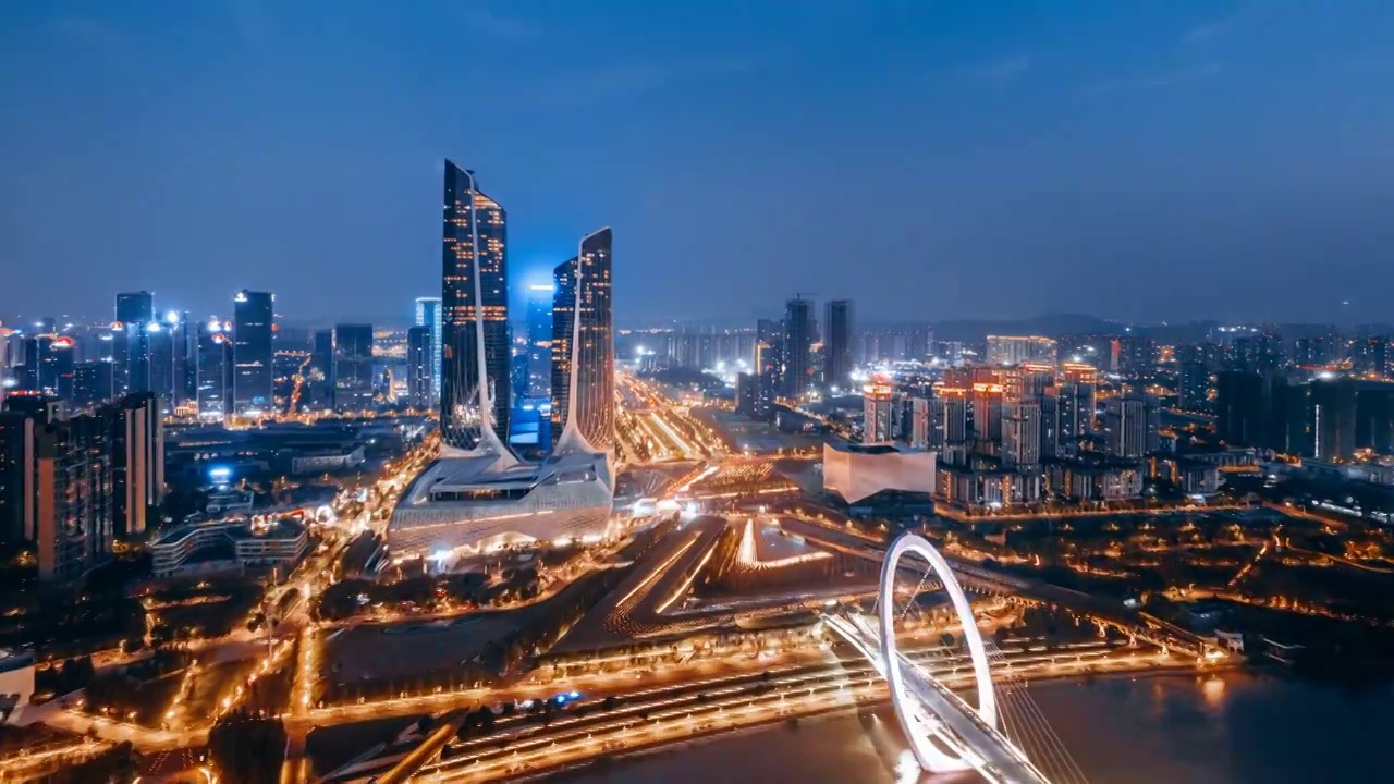 中国江苏南京河西青奥中心和南京眼大桥城市天际线航拍夜景延时摄影视频素材