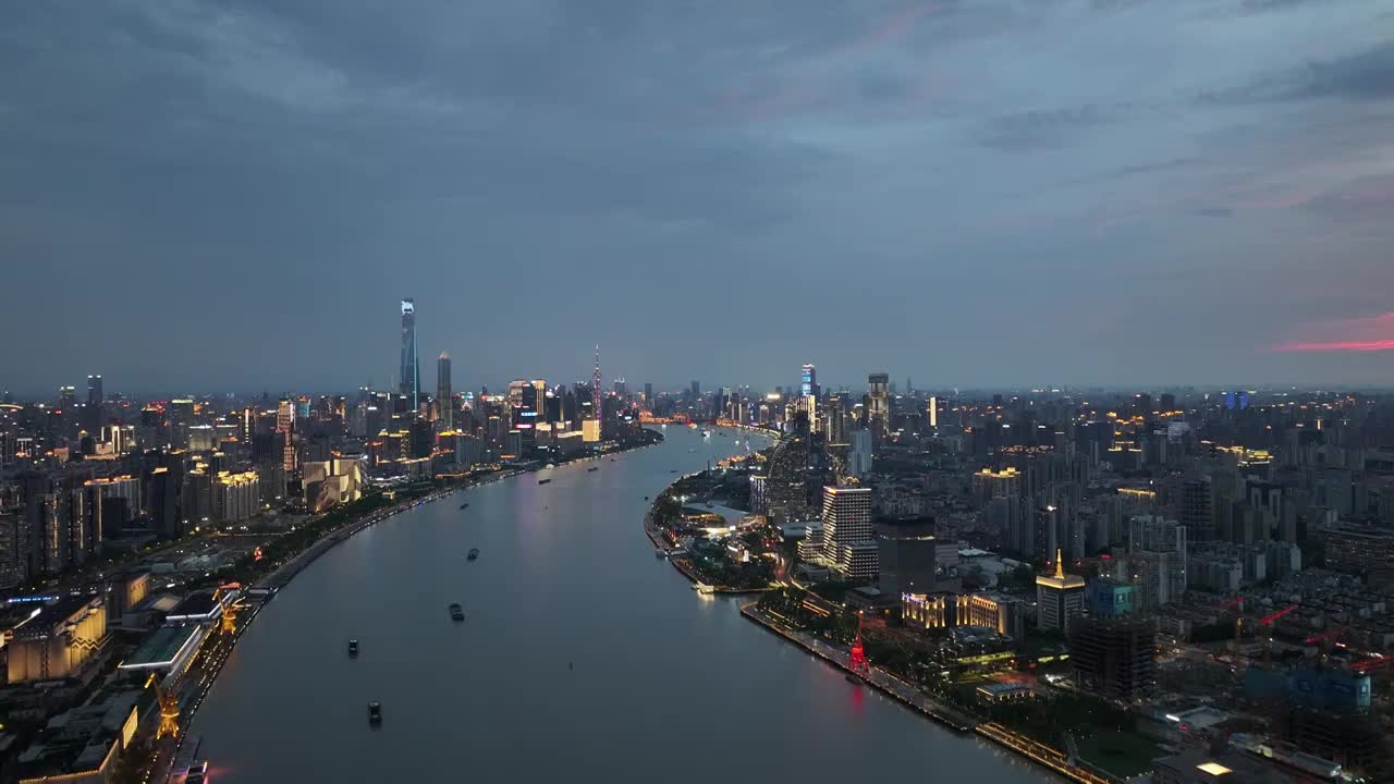 高空航拍黄浦江外滩方向夜景城市灯光秀蓝调时刻视频素材