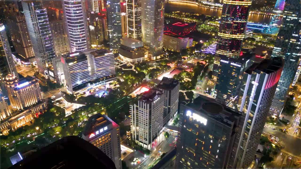 鸟瞰花城广场晚上购物中心写字楼外墙灯饰流光溢彩如梦如幻城市夜生活注入活力大都会商圈建筑美感亮丽风采视频素材