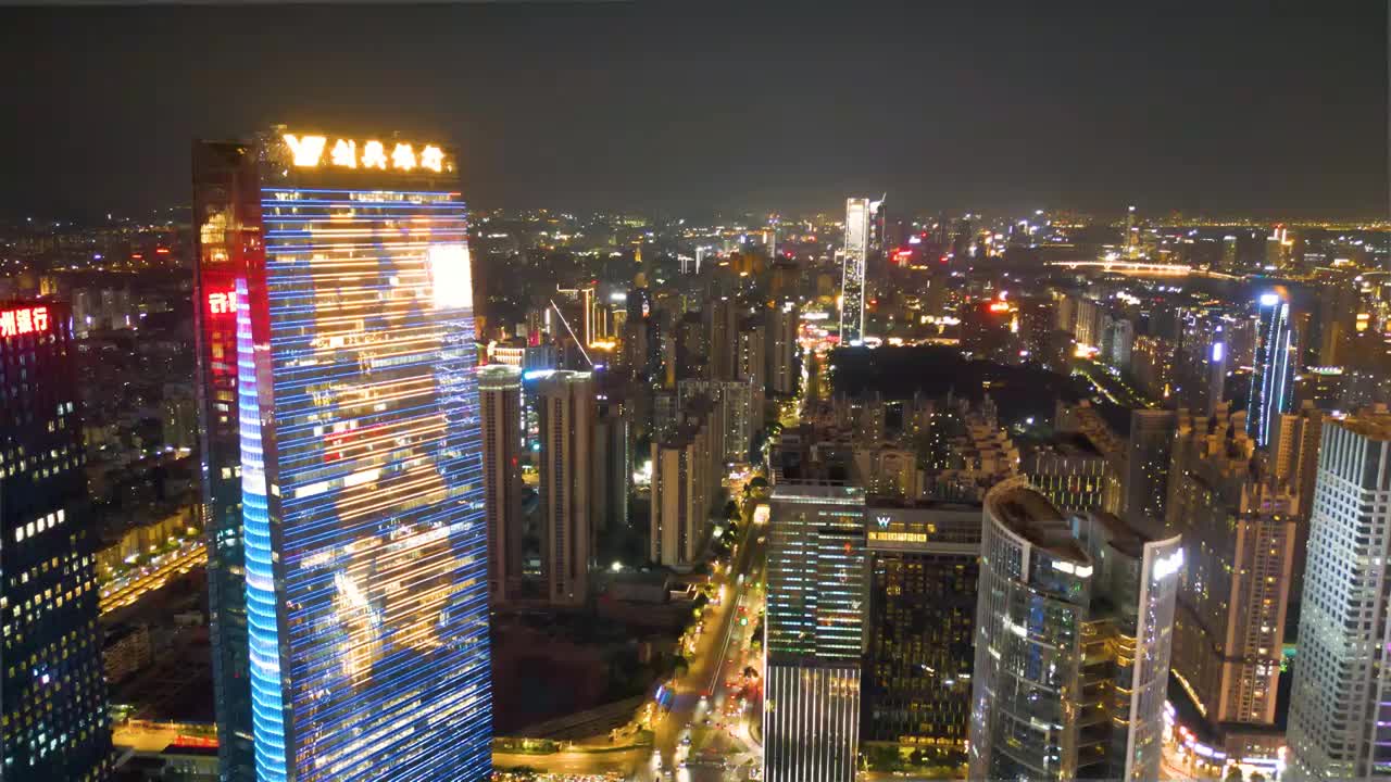 从半空俯瞰广州核心商圈现代城市建筑夜景亚洲国际顶级CBD岭南广州天河珠江新城密集办公楼地标建筑夜景视频素材