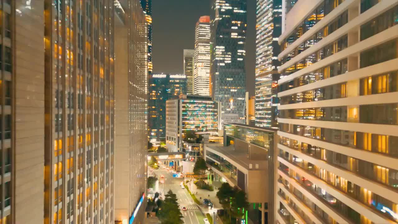 鸟瞰花城广场晚上购物中心写字楼外墙灯饰流光溢彩如梦如幻城市夜生活注入活力大都会商圈建筑美感亮丽风采视频素材