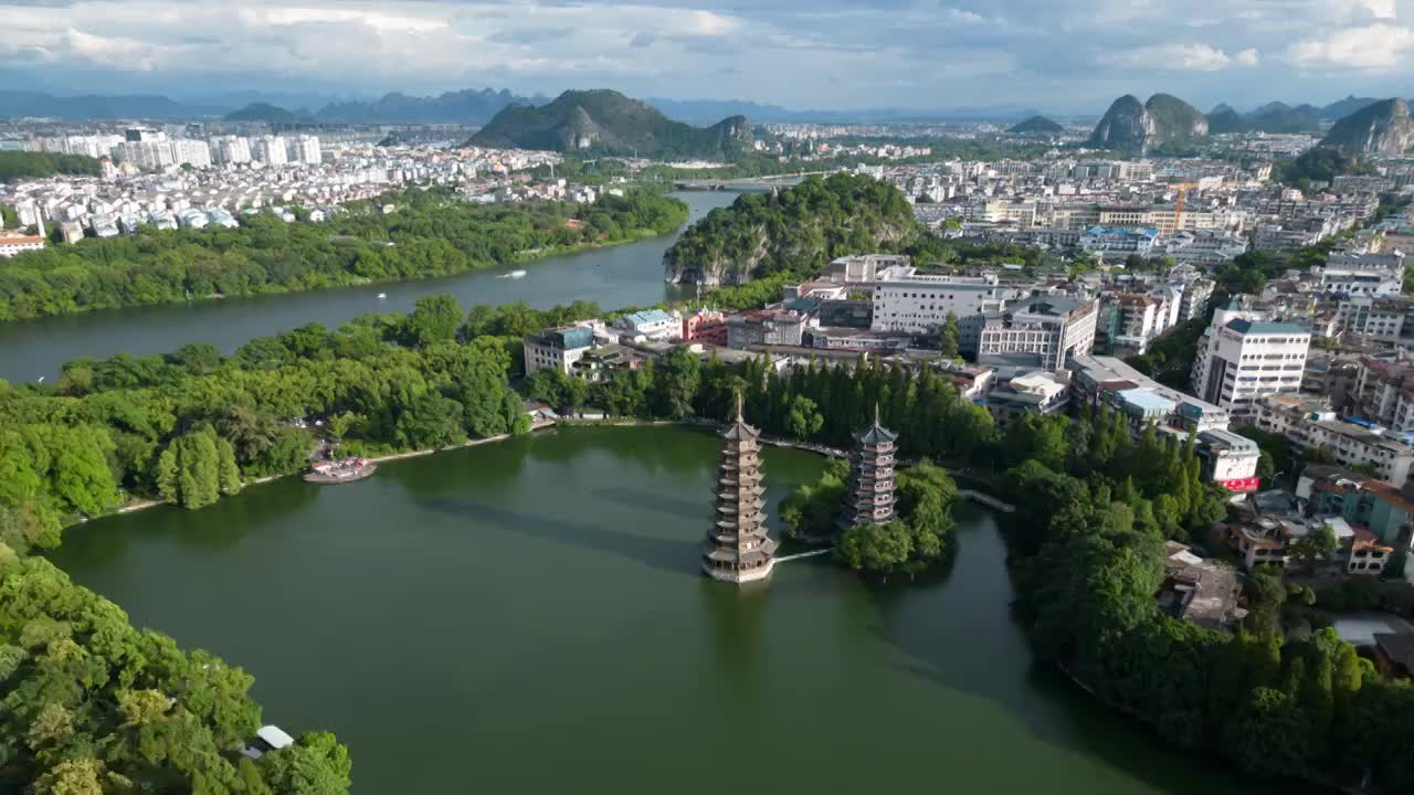 广西桂林地标日月双塔与象鼻山同框航拍延时摄影视频素材