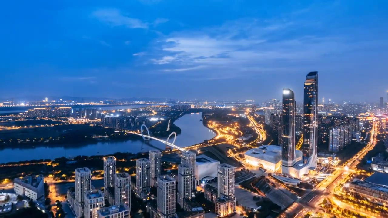 中国江苏南京河西区青奥中心保利大剧院天际线夜景航拍延时摄影视频素材