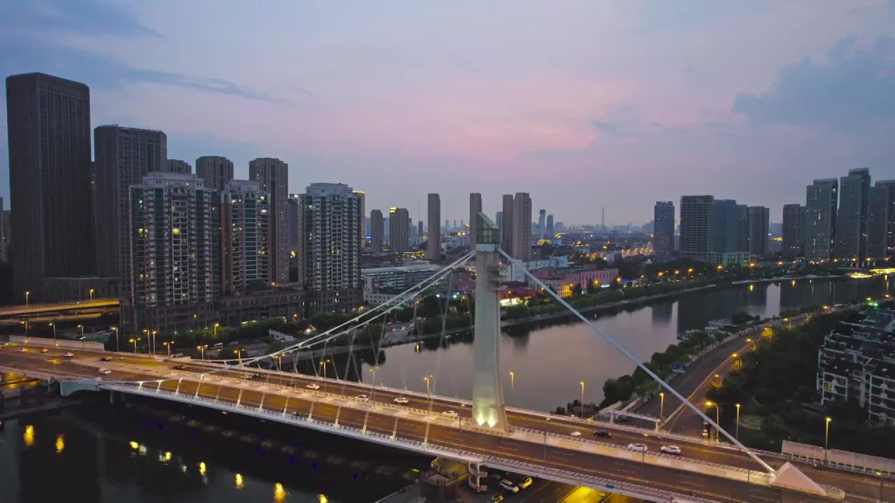 天津海河富民桥沿岸城市建筑日落风光航拍视频素材