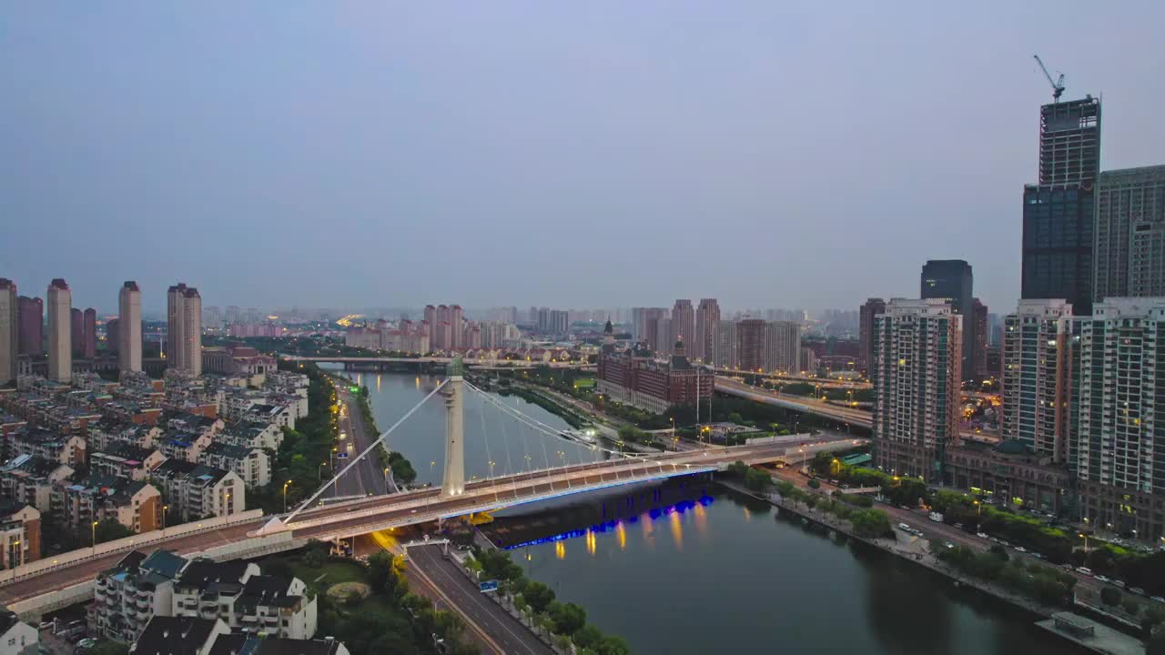 天津海河富民桥沿岸城市建筑日落风光航拍视频素材