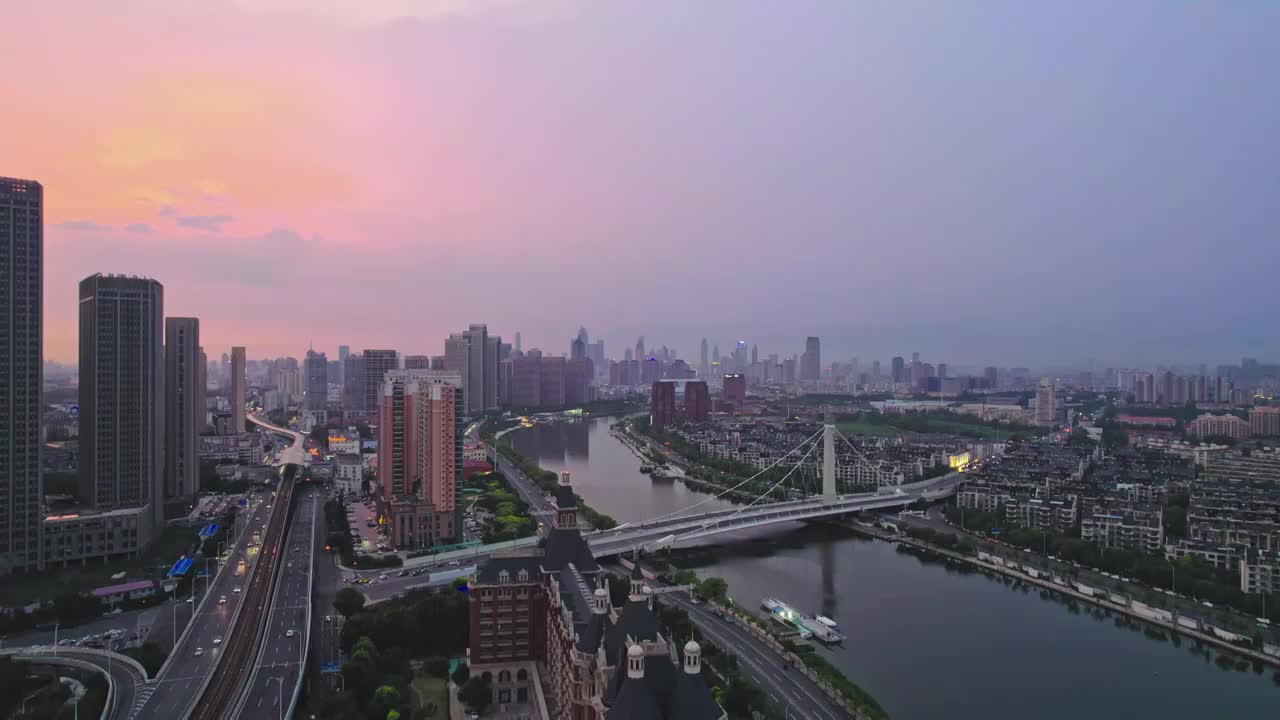 天津海河富民桥沿岸城市建筑日落风光航拍视频素材