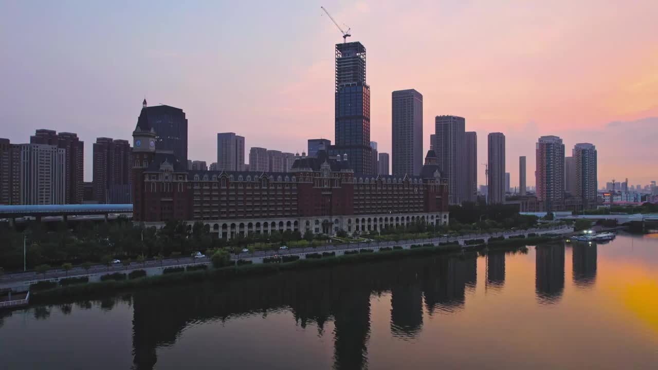 天津海河富民桥沿岸城市建筑日落风光航拍视频素材