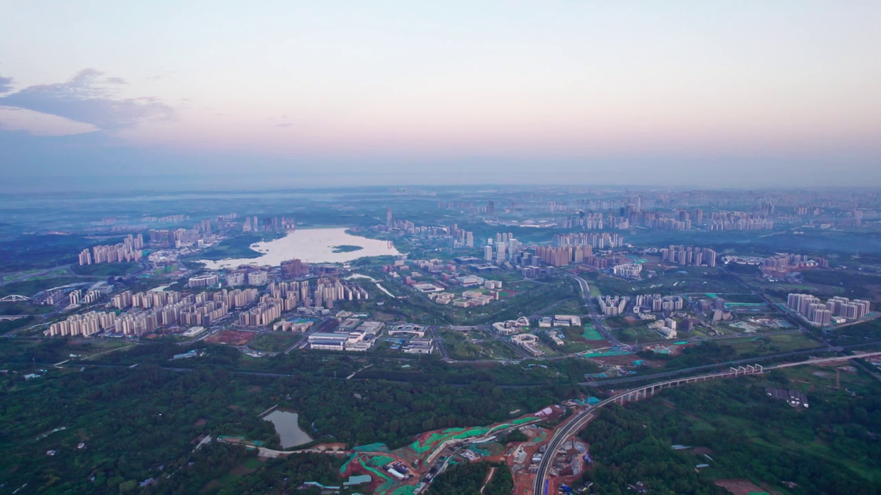 成都天府新区兴隆湖科学城和西博城建筑群日出城市风光航拍实时视频素材