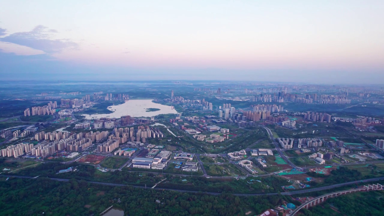 成都天府新区兴隆湖科学城和西博城建筑群日出城市风光航拍实时视频素材