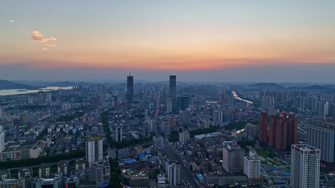 航拍徐州市主城区夕阳晚霞苏宁广场德基广场黄河观光带全景视频素材