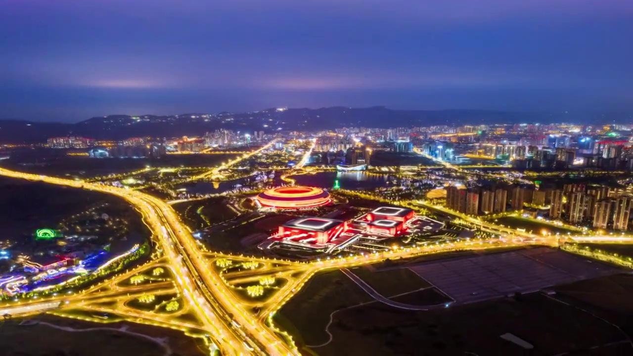 成都龙泉驿大运会主场馆和东安湖体育公园夜景航拍环绕移动延时摄影视频素材