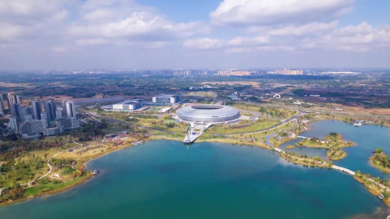 成都龙泉驿东安湖体育公园和大运会主场馆白昼晴天航拍环绕移动延时摄影视频素材