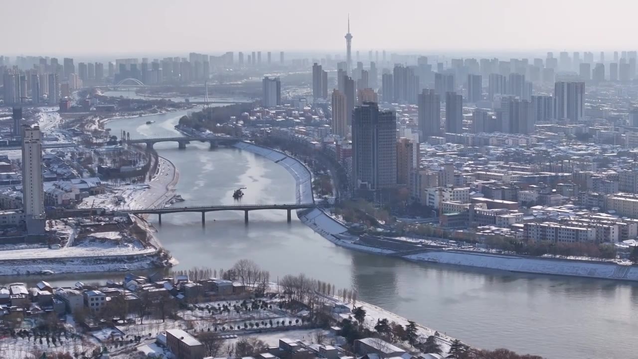 周口沙颍河贾鲁河交汇川汇区城市天际线雪景视频素材