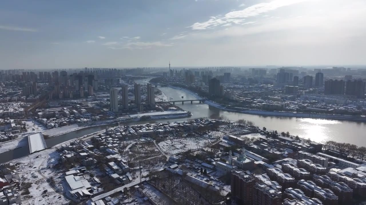 周口沙颍河贾鲁河交汇川汇区城市天际线雪景视频素材