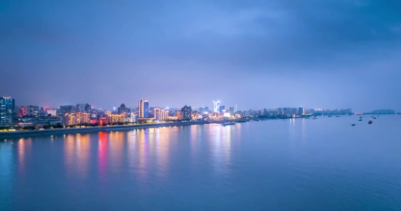 江畔城市九江雨后夜景航拍延时视频素材