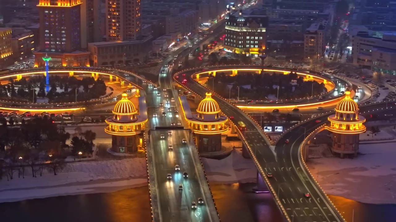 中国黑龙江哈尔滨城市夜晚雪景航拍视频素材