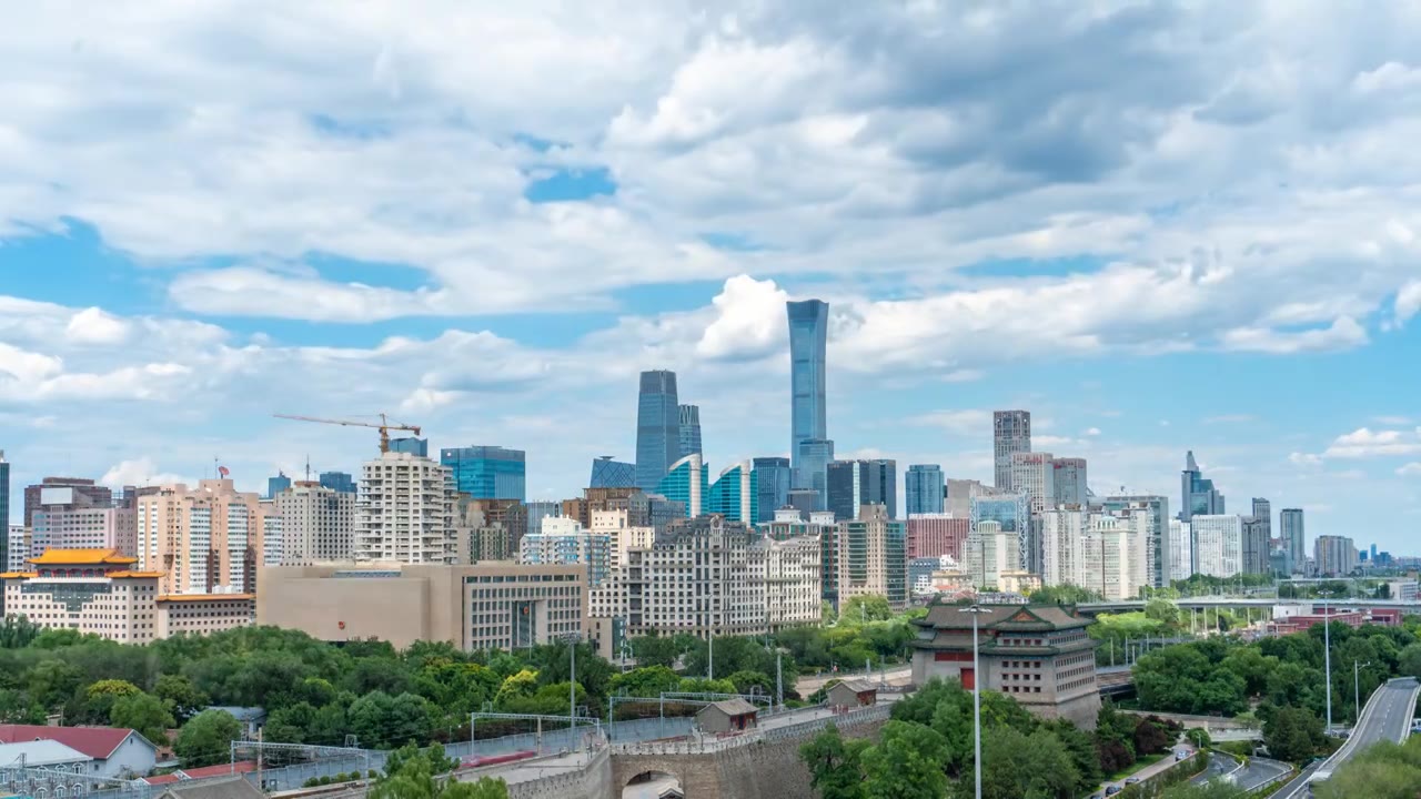 蓝天白云下的北京国贸CBD中国尊和古老的城墙箭楼城市天际线延时风光视频素材