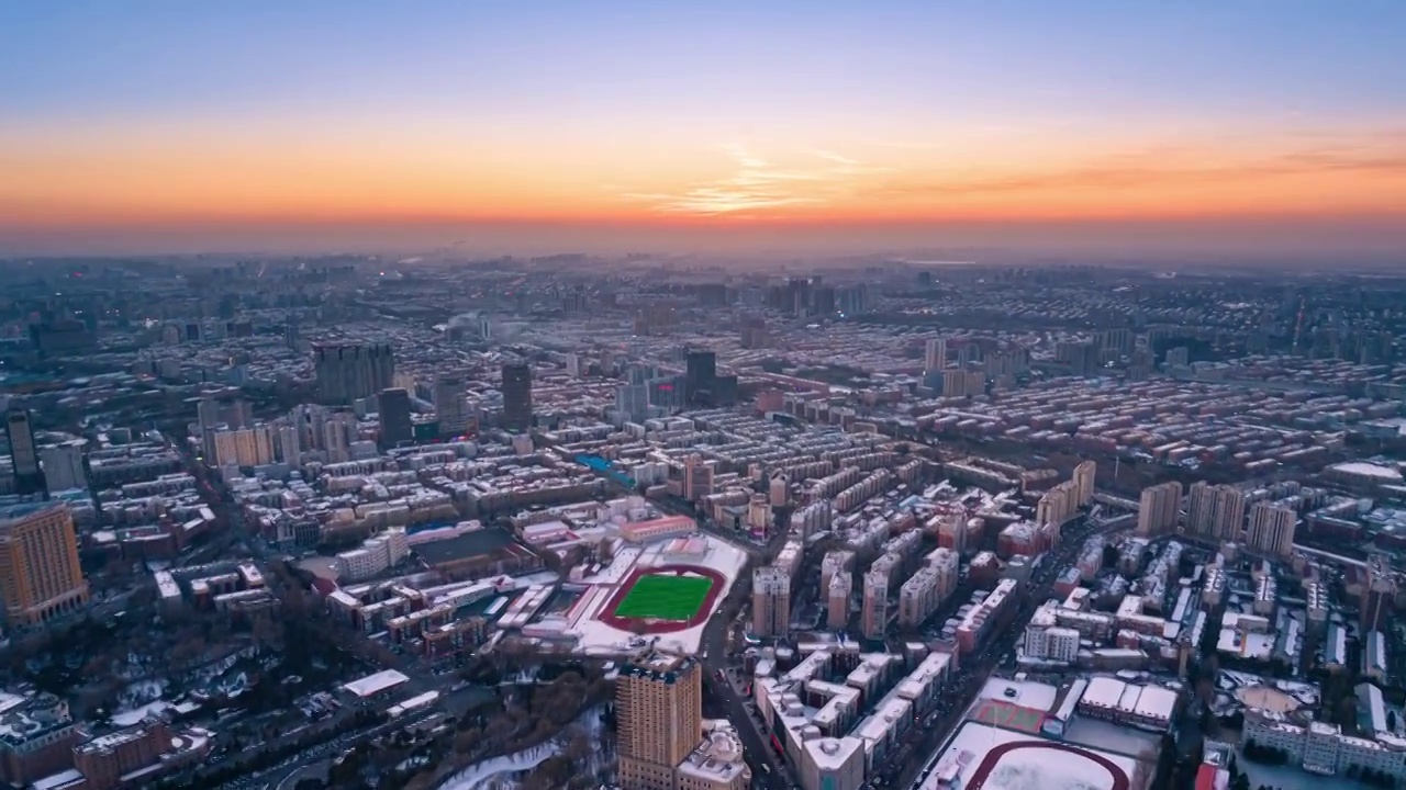 吉林长春朝阳区冬季雪景城市日落航拍视频素材