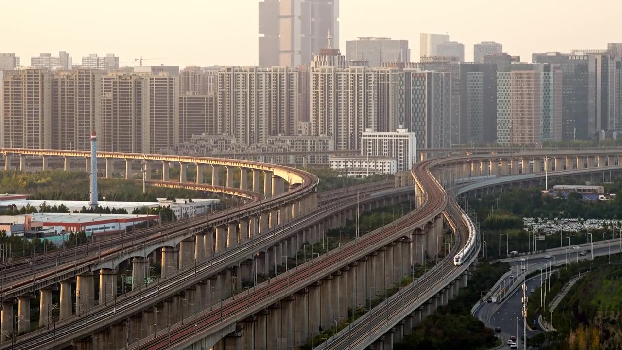 夕阳下高铁城市穿梭视频素材