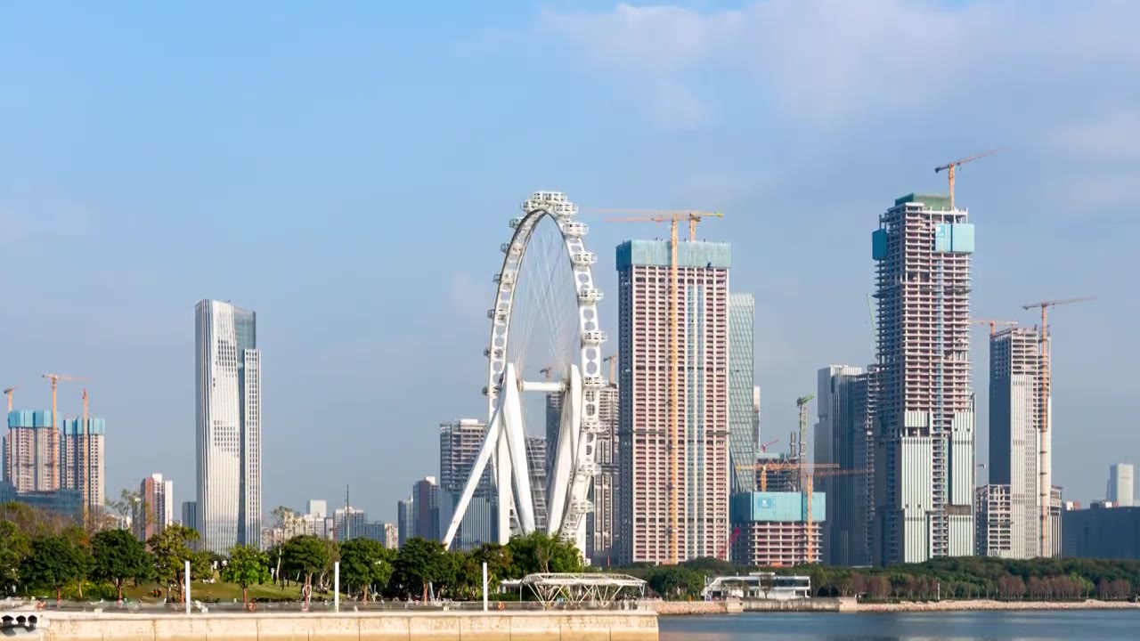 中国深圳前海CBD建筑群和湾区之光摩天轮延时摄影视频素材