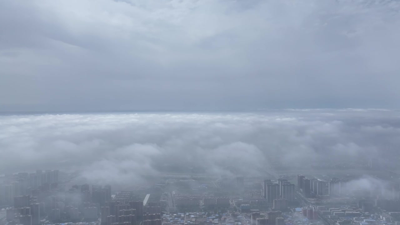 高视角有光云海周口城市上空云景，大场景视频素材