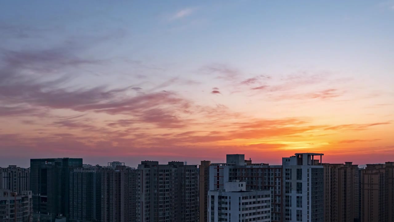 西安高楼大厦城市天际线日出时分红透天空的朝霞云景视频素材